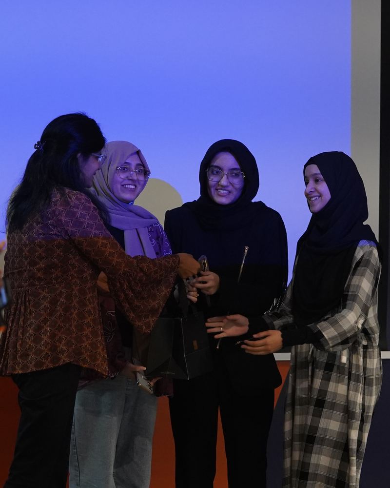 A team of women builders on stage at Algorism