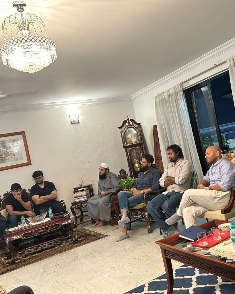 Majlis guests seated in a circle of conversation